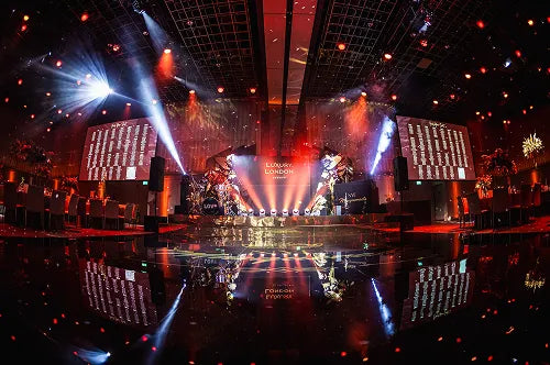 An empty stage and glossy dance floor with dramatic lighting at the London New Year's Eve Masquerade
